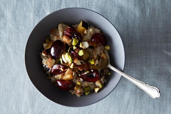 Whole oat groats with cherries, plums, pistachios & homemade almond milk