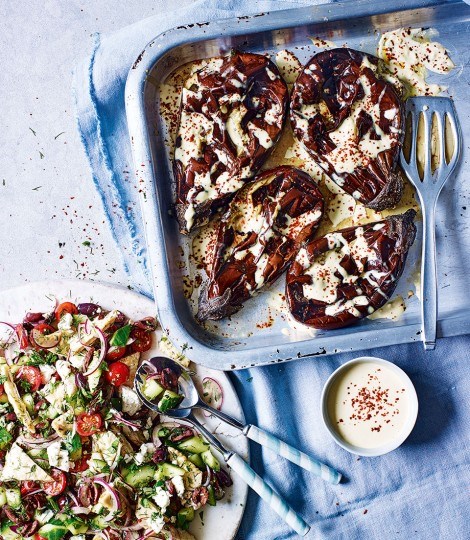 Whole roast aubergines with tahini sauce and Greek salad