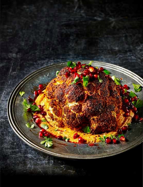 Whole roast cauliflower with warm harissa hummus