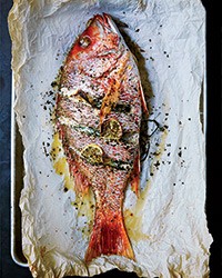 Whole roast fish with lemon and herbs