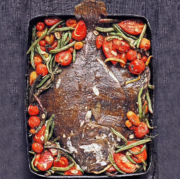 Whole roast flat fish with green beans and tomatoes