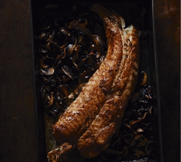Whole roast monkfish tail with mushrooms and thyme