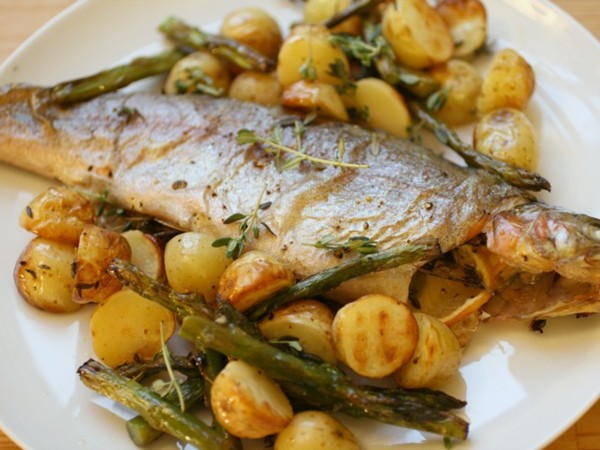 Whole roast trout with potatoes and asparagus