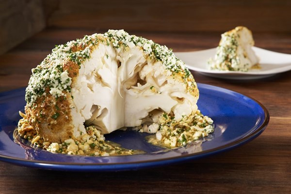 Whole roasted cauliflower slathered with feta and Greek honey (Kounoupidi olokliro psito me meli kai feta)