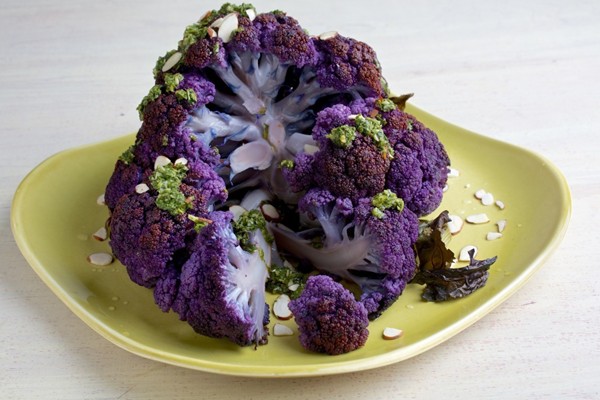 Whole roasted cauliflower with chimichurri and almonds