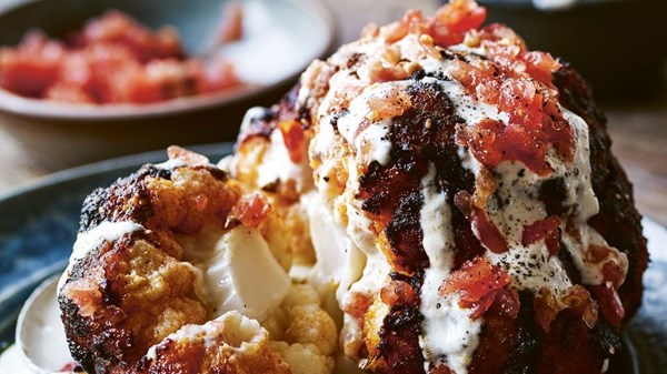 Whole roasted cauliflower with fresh tomatoes & tahini sauce