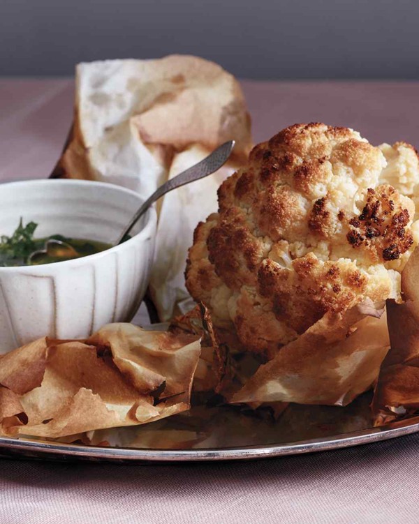 Whole roasted cauliflower with green herb sauce