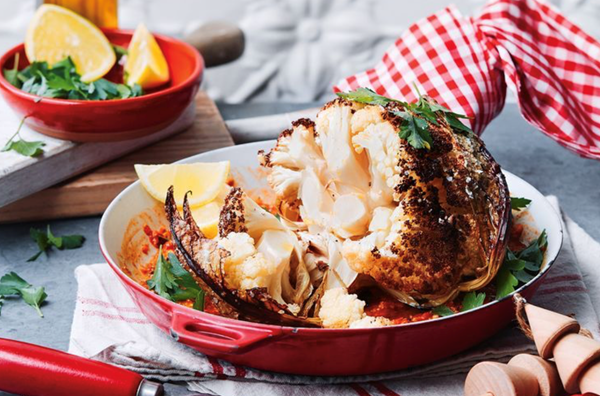 Whole roasted cauliflower with romesco sauce