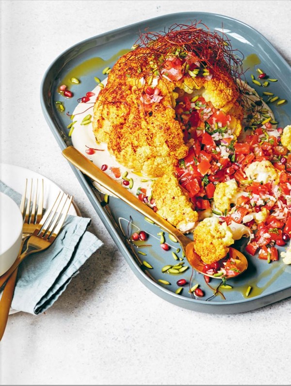 Whole roasted cauliflower with tahini and tomato salsa