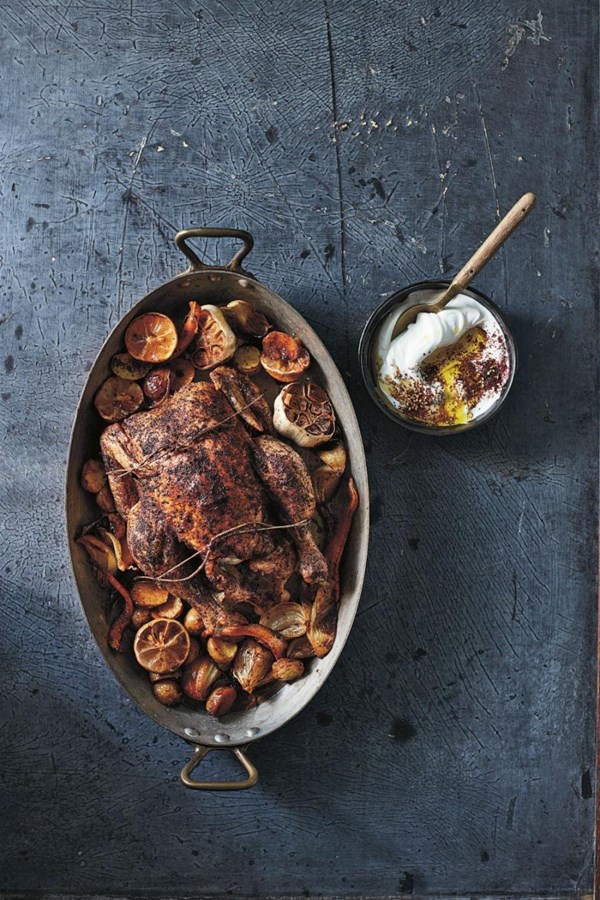 Whole roasted chicken with sumac, roasted vegetables, and sesame labne