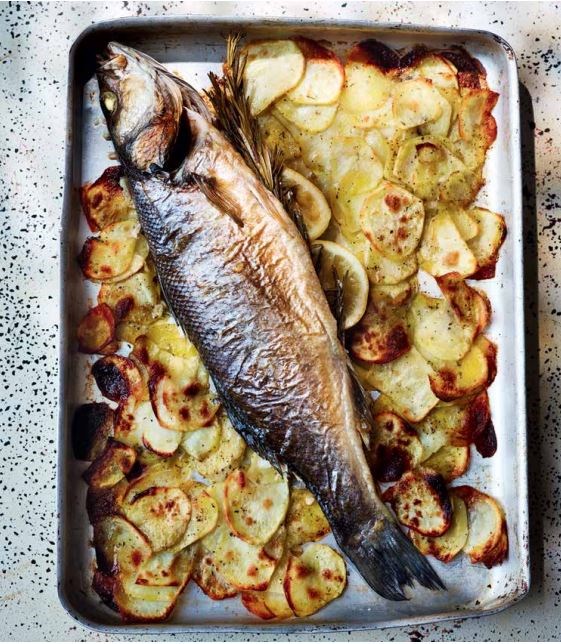 Whole roasted sea bass with rosemary, lemon and potatoes (Spigola al forno con rosmarino, limone e patate)