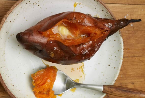 Whole roasted sweet potatoes with butter, molasses, and salt