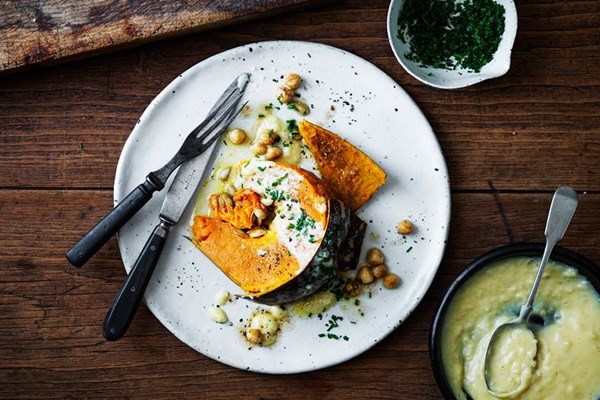 Whole salt-baked pumpkin with raclette cheese sauce