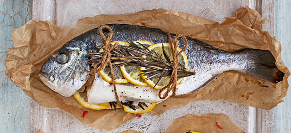 Whole sea bream cooked en papillote