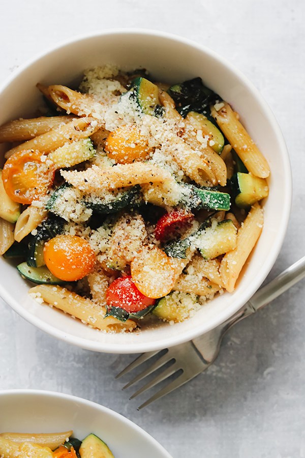 Whole wheat pasta and summer squash with tomatoes, basil, and pine nuts