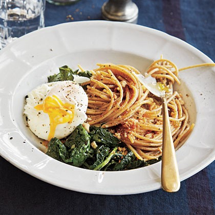 Whole wheat spaghetti with kale, poached eggs, and toasted breadcrumbs