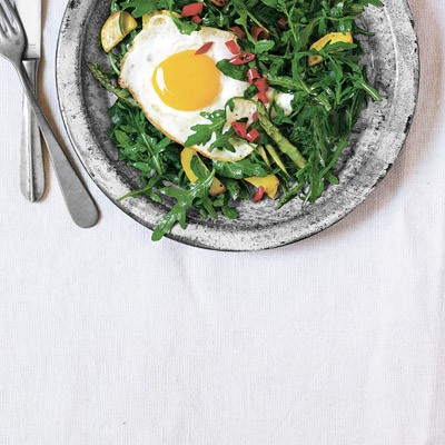 Wild arugula, summer squash and asparagus with a fried egg and hot pickled peppers