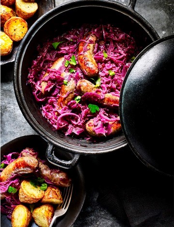 Wild boar bangers with cider-braised red cabbage