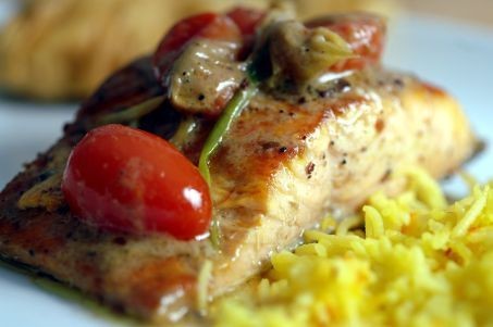 Wild salmon fillets poached with chiles, scallions, and tomato