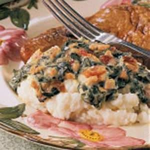 Wilted greens over potatoes