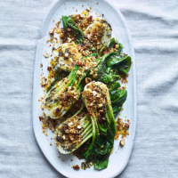 Wilted pak choi with crispy breadcrumbs and almonds