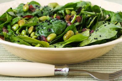 Wilted spinach salad with edamame, red onion, and black sesame seeds