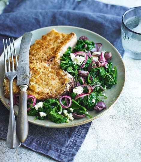 Wilted spinach with crumbed pork cutlets