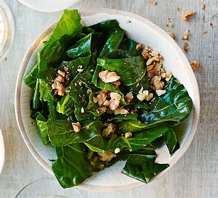 Wilted spring greens in nut oil 