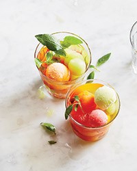 Wine punch with melon ice cubes