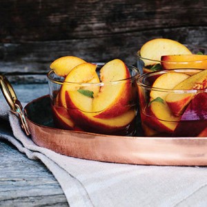 Wine-soaked peaches with lemon verbena