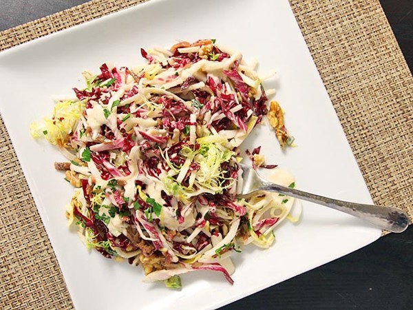 Winter green salad with walnuts, apples, and Parmesan-anchovy dressing
