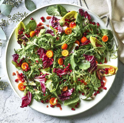 Winter greens salad with pomegranate & kumquats