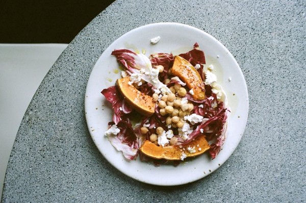 Winter salad with roasted pumpkin and feta in an egg yolk dressing