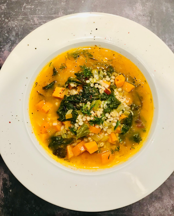Winter vegetable broth with zesty parsley dressing