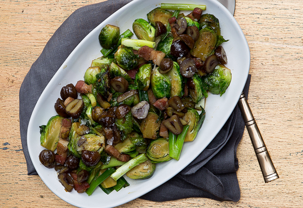 Wok-fried Brussels sprouts and bacon with crispy chestnuts