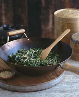 Wok-tossed water spinach with fermented bean curd sauce (Rau muông xào chao)
