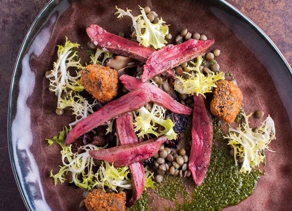 Wood pigeon with salsa verde and black pudding beignets