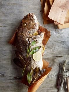 Wood-wrapped spit-roasted fish (Pesce allo spiedo)