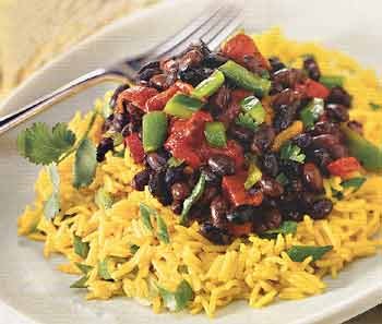 Yellow rice salad with roasted peppers and spicy black beans