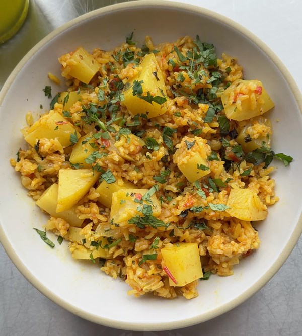 Yellow rice with cilantro, mint, and potatoes (Tehri)