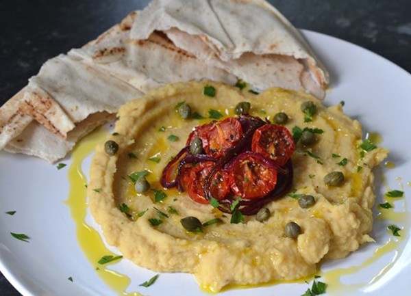 Yellow split pea purée with slow roast Piccolo tomatoes, caramelised onion and capers