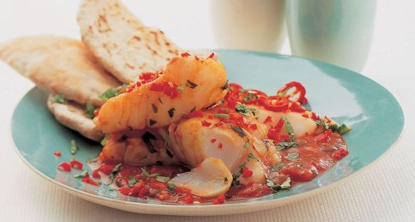 Yemeni poached fish in spicy tomato herb sauce