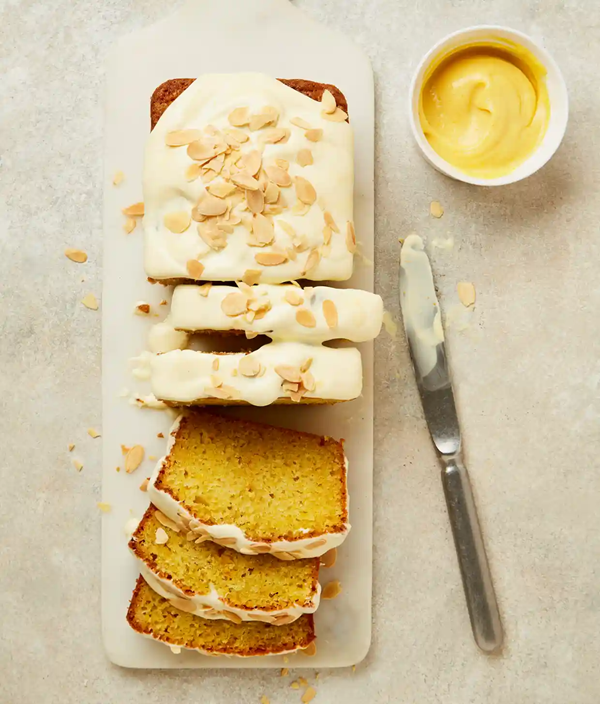Yoghurt loaf cake with orange curd and almonds