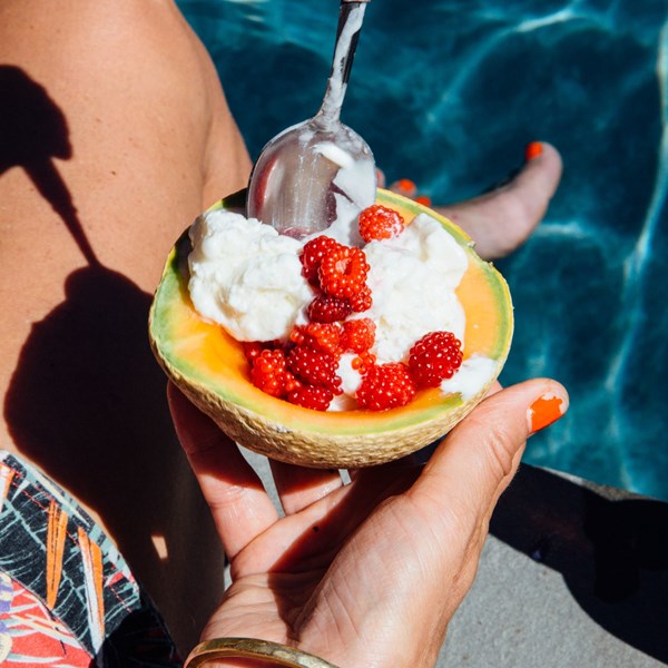 Yogurt granita with melon and raspberries