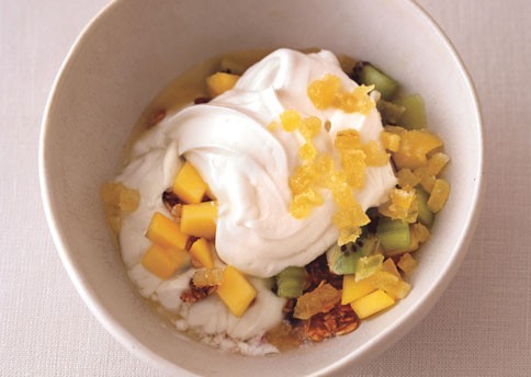 Yogurt with granola, tropical fruit, and crystallized ginger