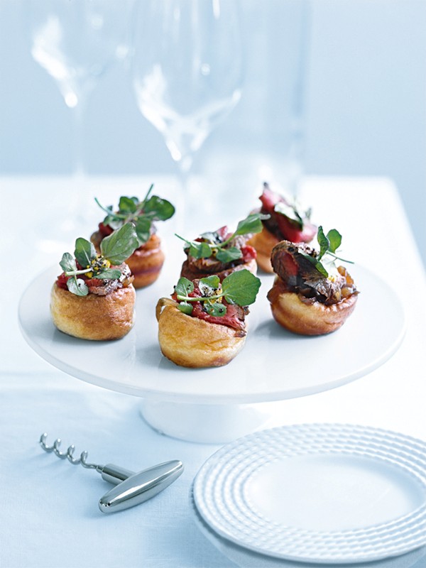 Yorkshire puddings with rare beef and caramelised onions