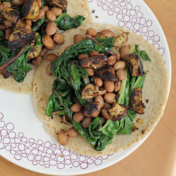 Za'atar and aleppo pepper roasted potato, bean and Swiss chard tacos