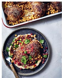 Za’atar chicken served with hummus, pine nuts and pomegranate