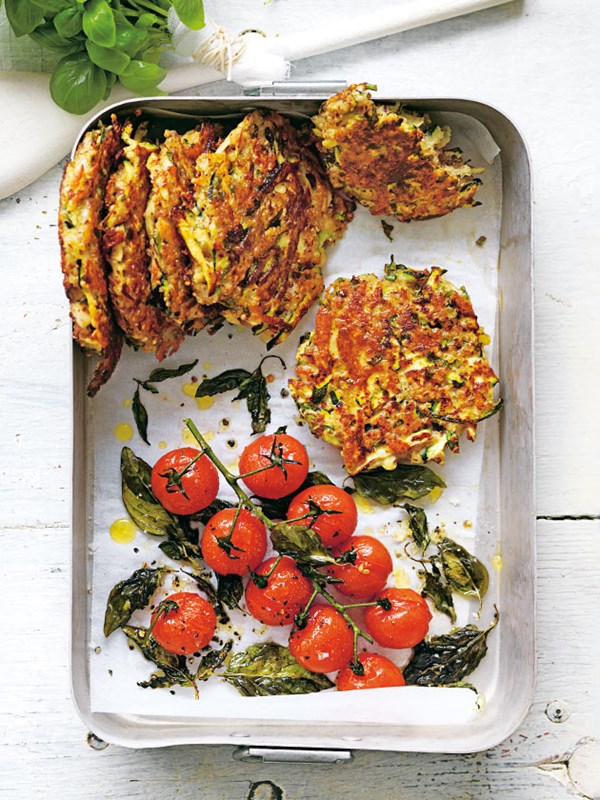 Zucchini and haloumi fritters with roasted tomatoes