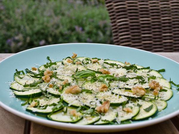 Zucchini carpaccio salad with Parmesan, basil, and walnuts